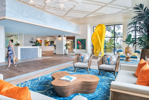 Bright hotel lobby interior showcasing open design, seating areas, and welcoming guest arrival experience.